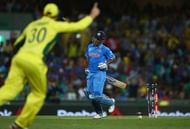 SYDNEY, AUSTRALIA - MARCH 26: MS Dhoni of India is run out by Glenn Maxwell of Australia  during the 2015 Cricket World Cup Semi Final match between Australia and India at Sydney Cricket Ground on March 26, 2015 in Sydney, Australia.  (Photo by Ryan Pierse/Getty Images)